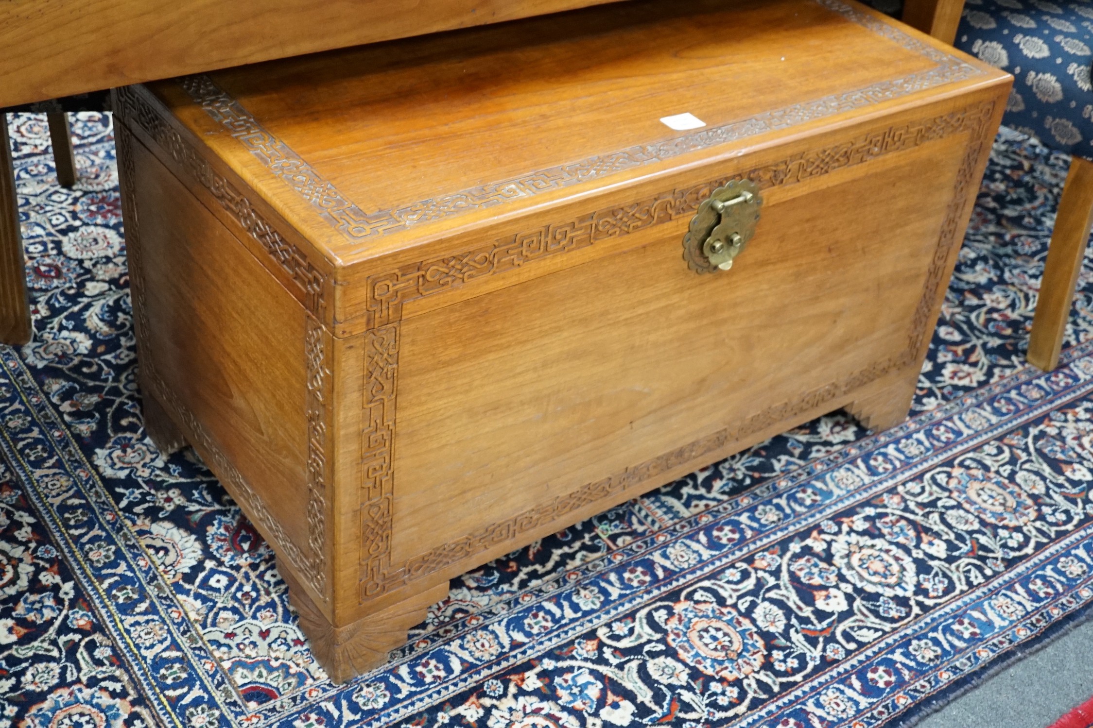 A Chinese carved camphorwood chest, width 97cm *Please note the sale commences at 9am.